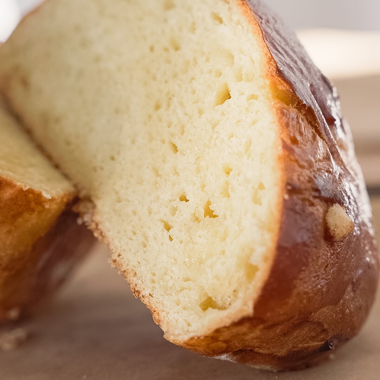 Delicious and fluffy Craquelin bread. Sliced brioche showcasing its fluffy interior and rich, buttery texture.