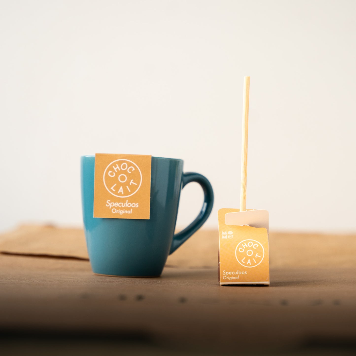 Choc-o-lait Speculoos stick with a blue mug, featuring a blend of milk chocolate and the classic Belgian gingerbread flavor for an indulgent hot chocolate treat.