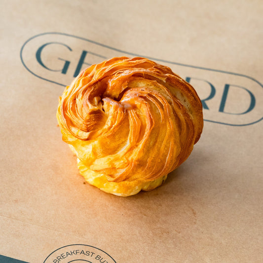 Golden Fleur de Caramel pastry with buttery layers and a rich salted caramel filling