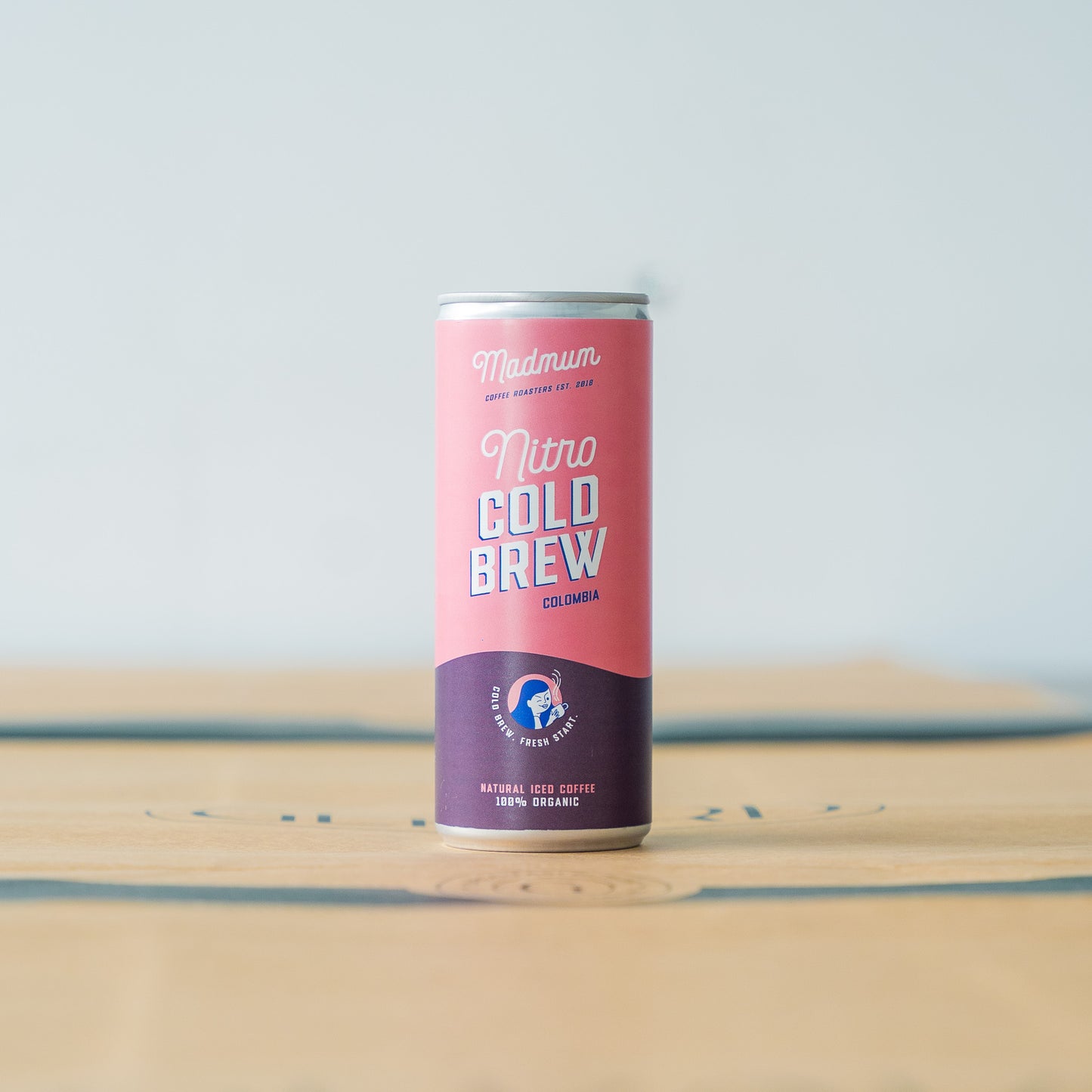 Madmum Nitro Cold Brew coffee can featuring 100% organic iced coffee from Colombia, offering a smooth and refreshing taste for coffee enthusiasts