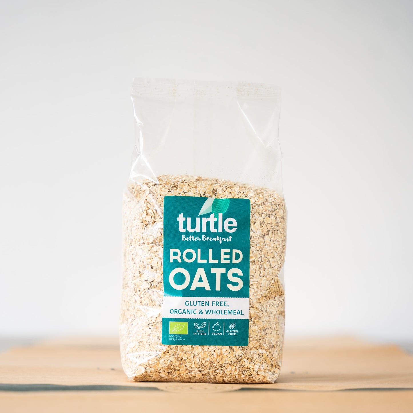 Turtle rolled oats are showcased on a wooden table, emphasizing their versatility as a healthy, organic breakfast option