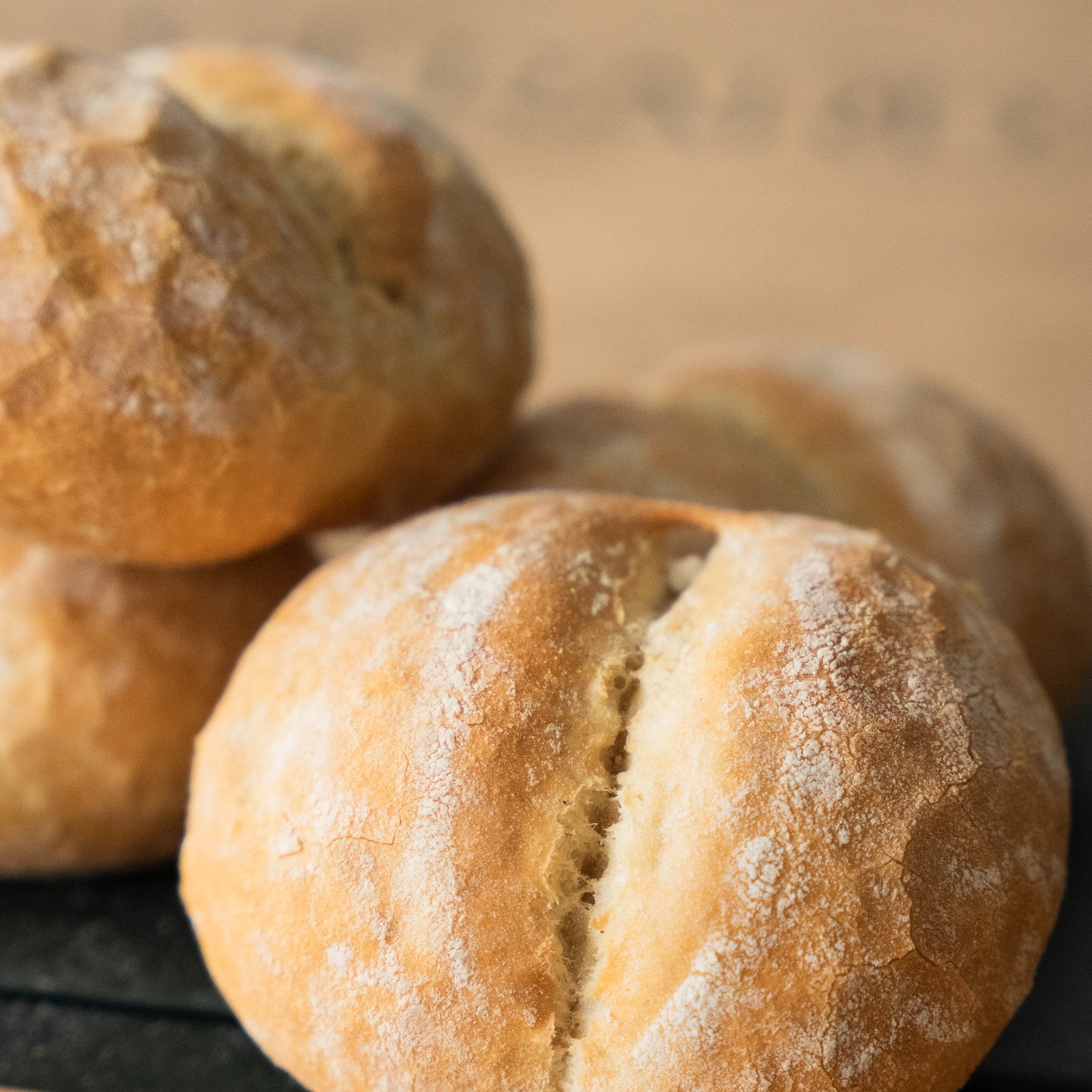 light and airy artisan belgian pistolets with a golden-brown crust and subtle cracks, perfect for a fresh breakfast or lunch