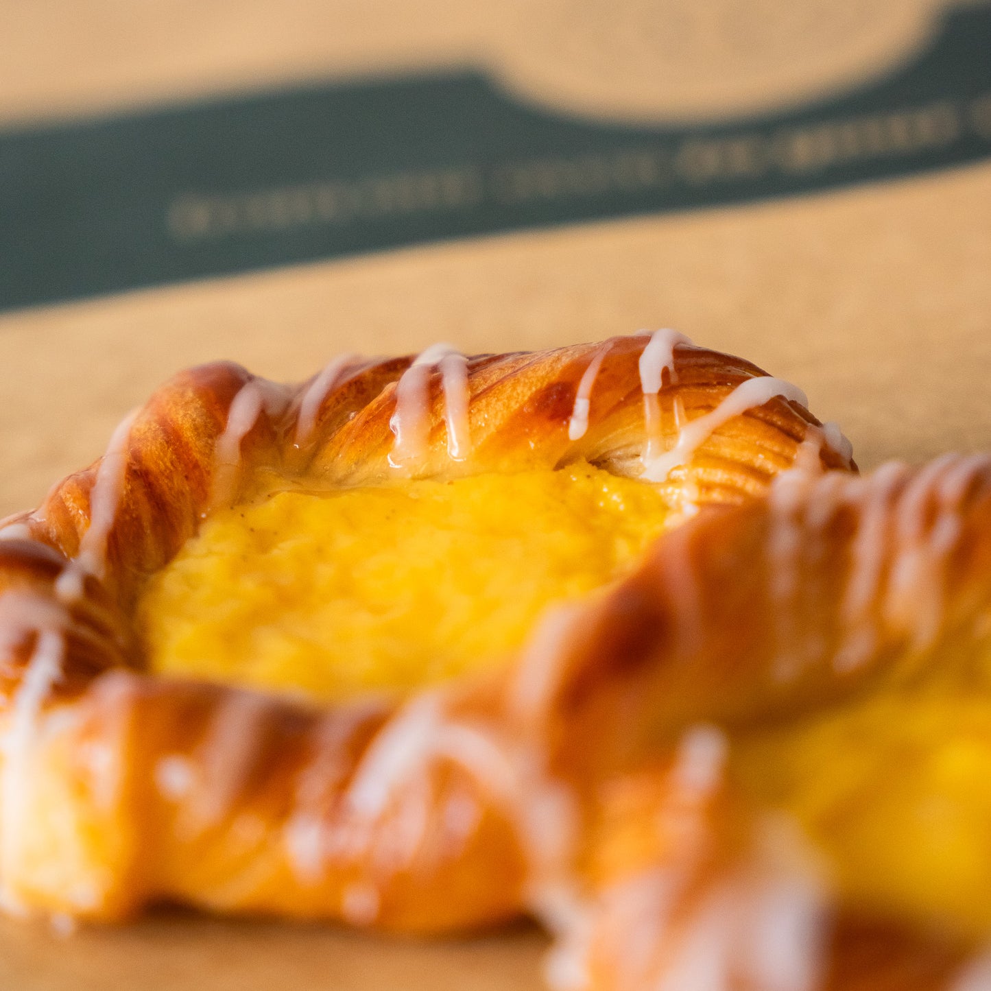 Close-up of a light and buttery puff pastry filled with rich cream, perfect as a sweet treat or breakfast.