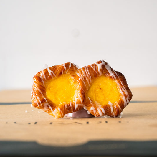 Figure-eight shaped puff pastry with golden, flaky layers and a creamy custard center