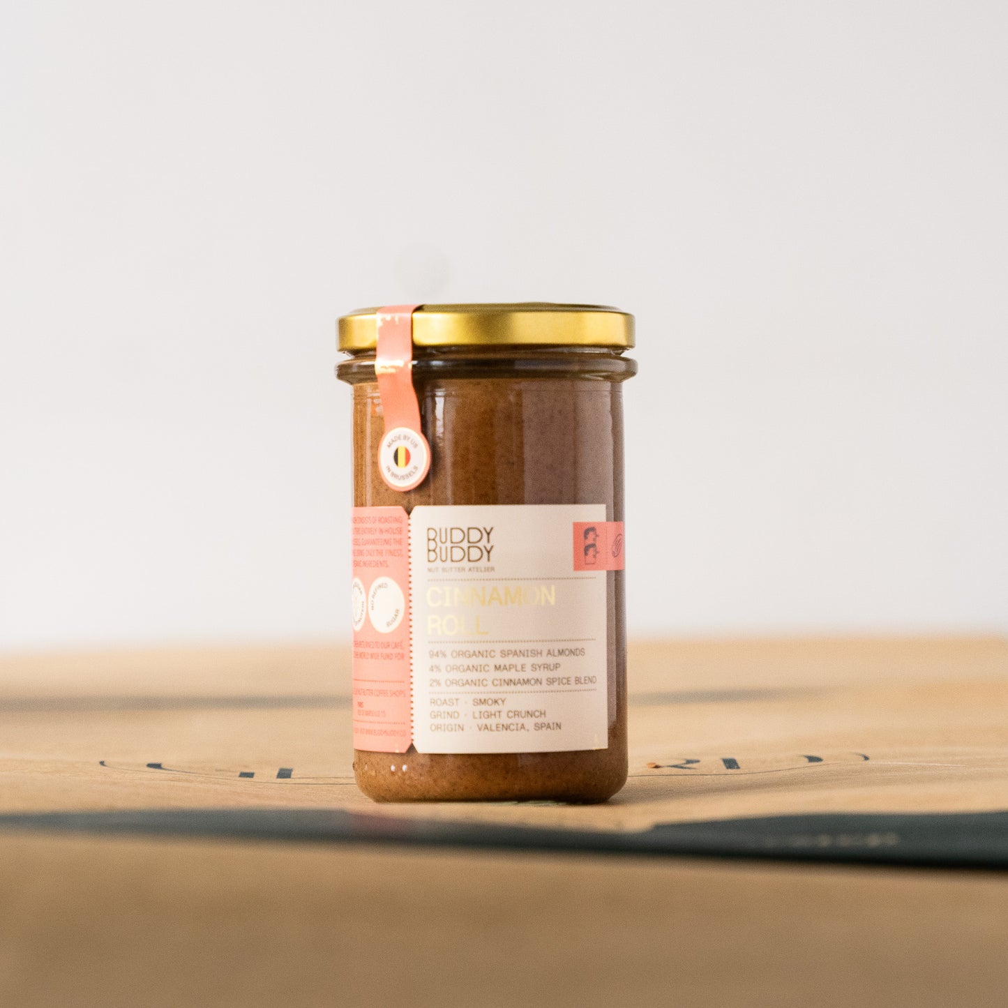 Buddy Buddy cinnamon roll almond butter in a glass jar, crafted with organic Spanish almonds, maple syrup, and cinnamon spice