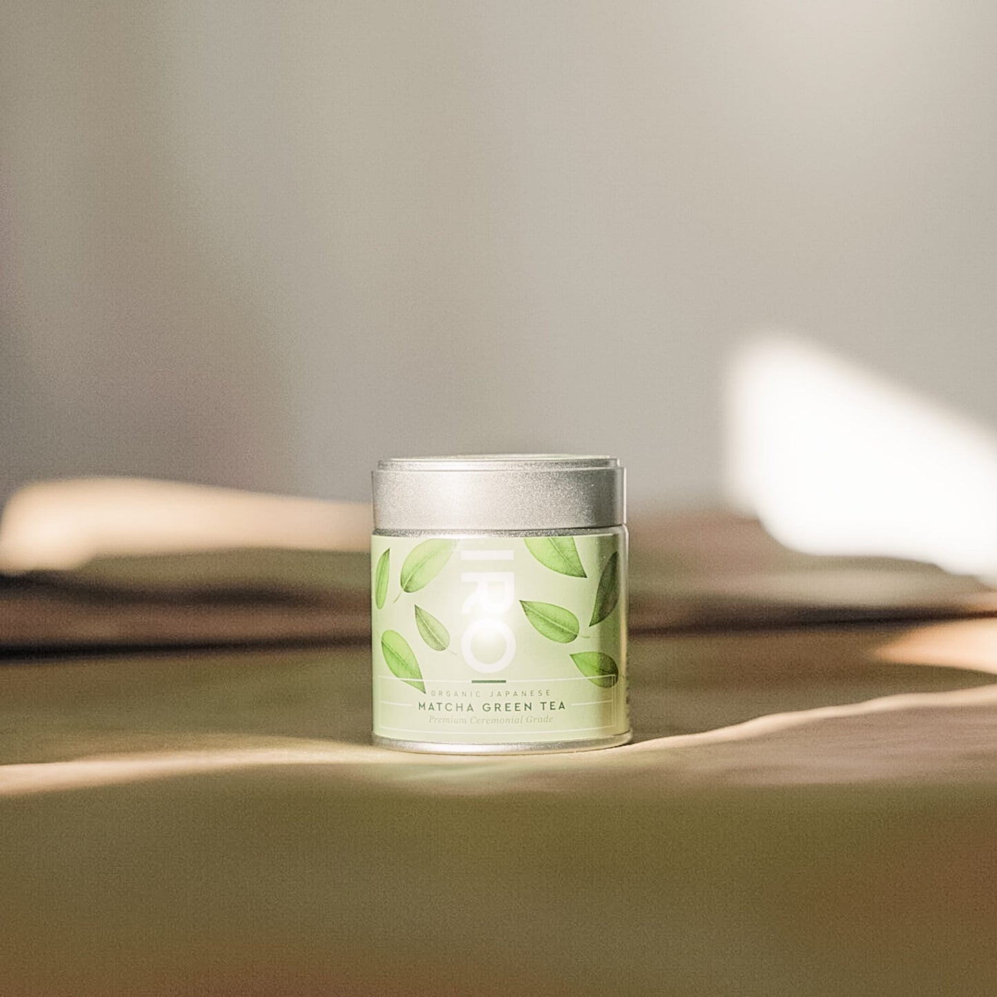 Tin of 100% organic Premium Ceremonial Grade Matcha tea from IRO, sourced from Kagoshima, Japan, showcasing its rich flavor and exceptional health benefits