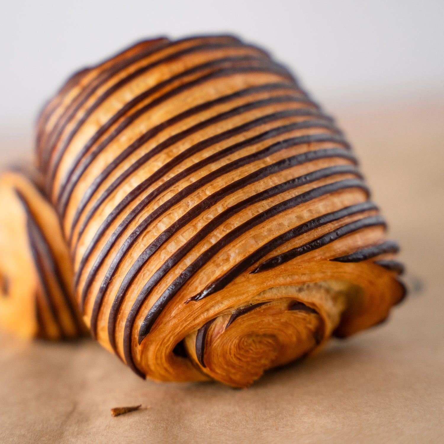 Close-up of Gérard Bakery's iconic chocolate pastry with delicate chocolate layers and a golden crust.