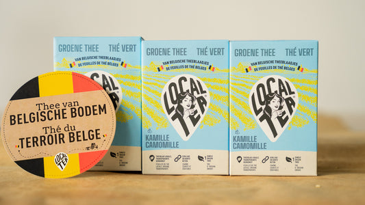 Three green-camomile tea packages placed next to each other with the writing "Tea from Belgian territory".