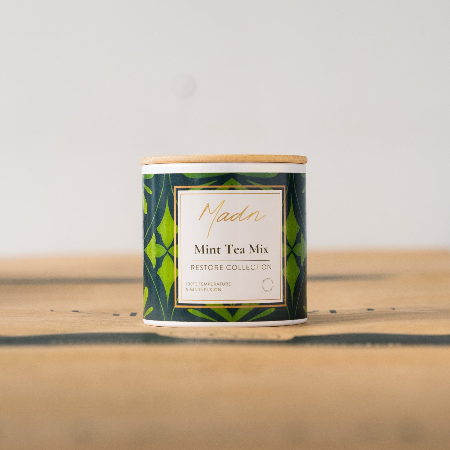 Madn Mint Tea Mix from the Restore Collection in a stylish tin, offering a refreshing and calming infusion for tea enthusiasts