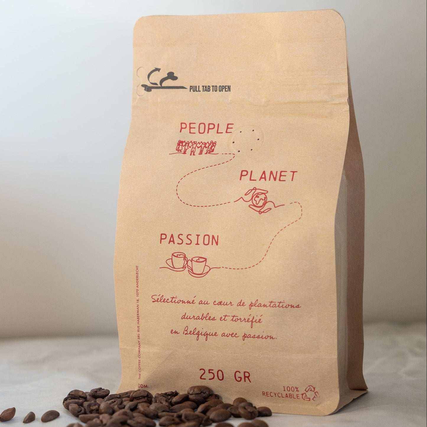 Coffee beans sourced from the cooperative Cocagua in Guatemala into a Origin Coffee packaging with some beans laying around